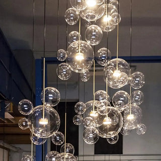 Casual LED Light Fixture with Translucent Glass Ball Pendant and Subdued Light via Cord Zawala Image - 2