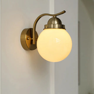 Minimalist Globe Glass Shade Brass Metal Wall Sconce Zawala Image - 1