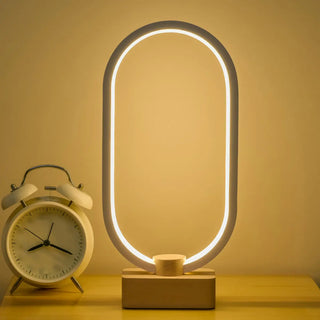 Modern Simple Oval LED Warm White Acrylic Table Lamp Image - 5
