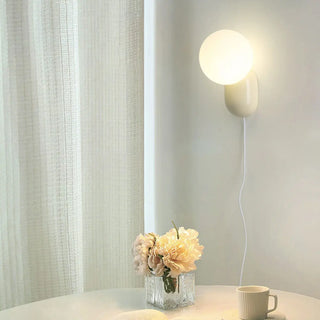 Modern Minimalist White Globe Resin LED Wall Light Zawala Image - 3