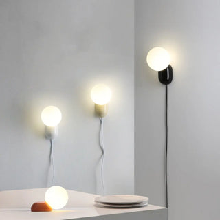 Modern Minimalist White Globe Resin LED Wall Light Zawala Image - 7