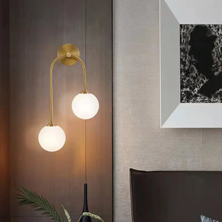 Modern Gold Frosted Glass Globe Metal Wall Sconce Zawala Image - 1
