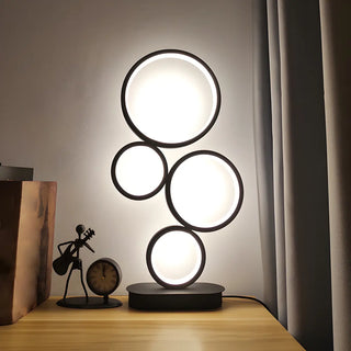 Simple Stylish Black Round 4 Lights LED Table Lamp Zawala Image - 1